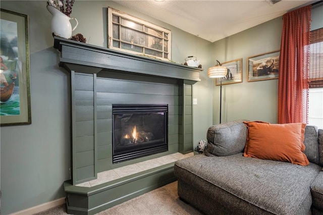 details with a glass covered fireplace, carpet flooring, and baseboards