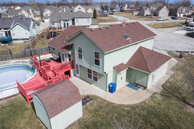 birds eye view of property with a residential view