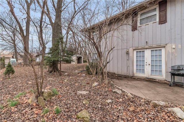 view of yard with a patio and french doors