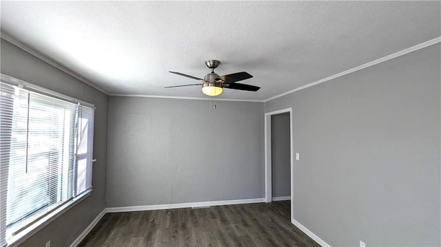 empty room with crown molding, dark wood finished floors, a ceiling fan, a textured ceiling, and baseboards