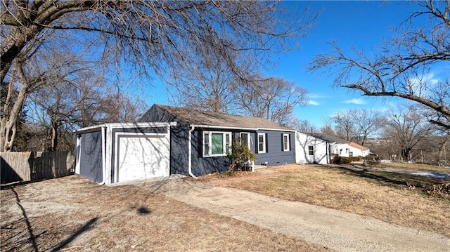 view of front facade with a garage, fence, driveway, crawl space, and a front yard