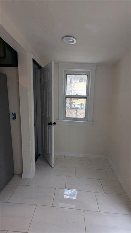 corridor with baseboards