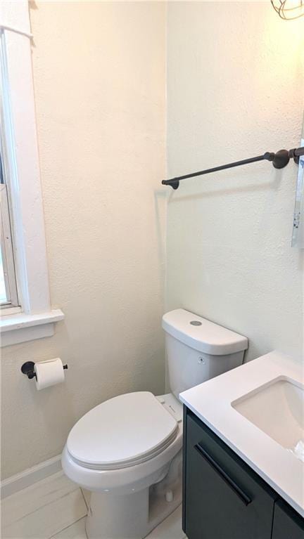 bathroom with toilet and vanity