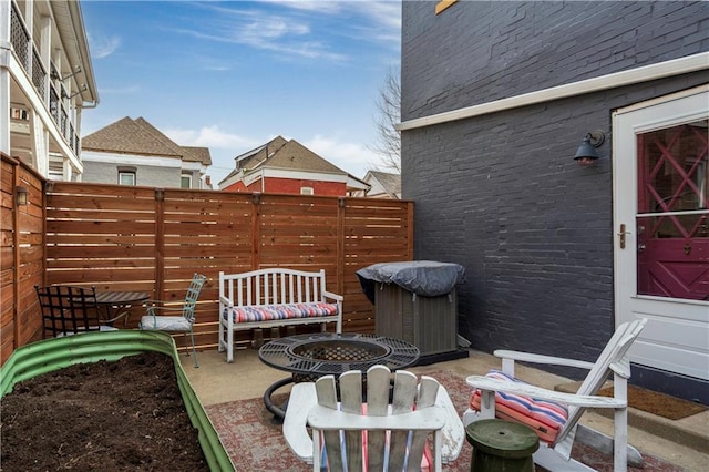 view of patio / terrace featuring fence