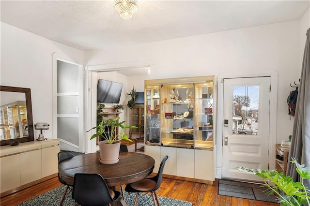 dining area with wood finished floors