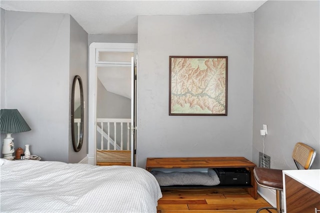 bedroom featuring wood finished floors