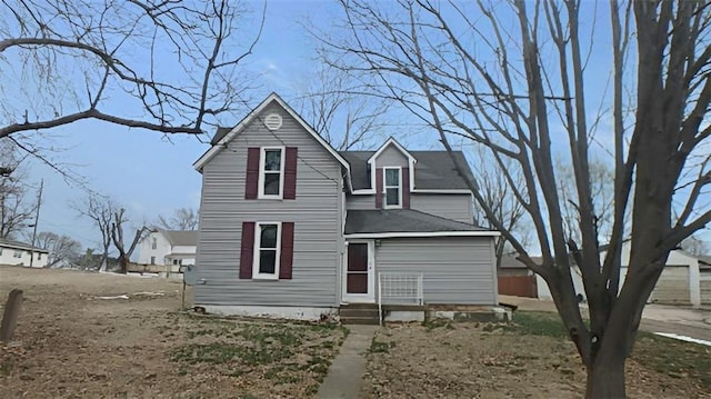 back of property featuring entry steps