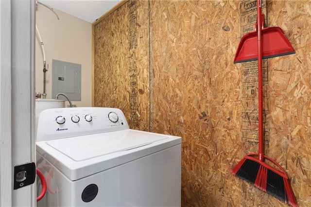 clothes washing area with electric panel, laundry area, and washer / clothes dryer