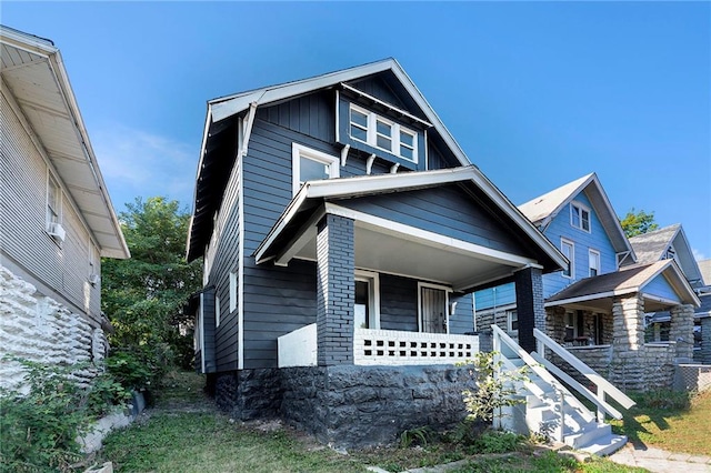 view of front of property with board and batten siding and covered porch