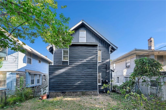 back of house with fence