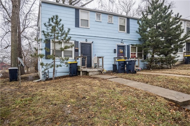 view of front of property featuring fence