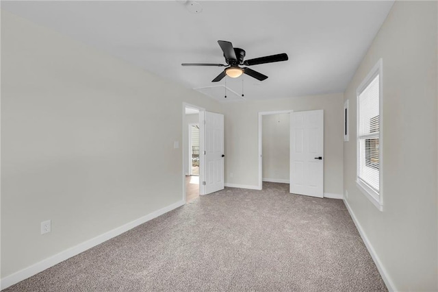 unfurnished bedroom featuring carpet flooring, ceiling fan, and baseboards