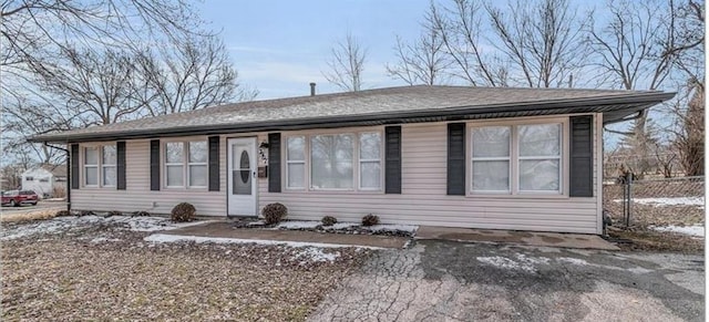 view of front of house featuring fence