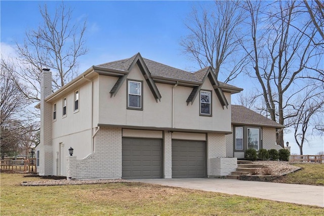 view of front of home featuring driveway, a garage, a chimney, a front lawn, and brick siding