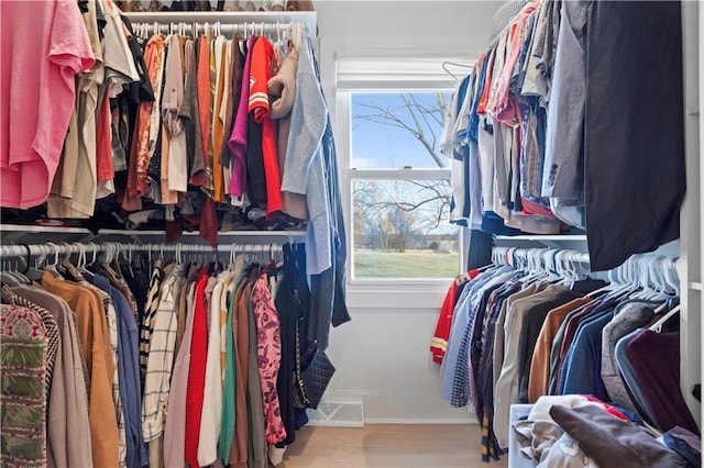 spacious closet featuring visible vents