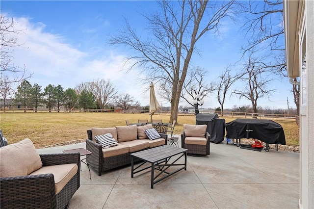 view of patio with a grill, fence, and an outdoor hangout area