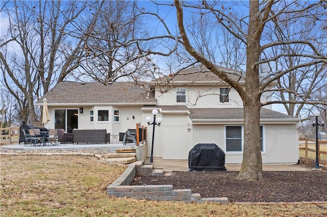 back of property with a patio area and an outdoor hangout area