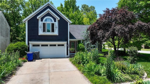 14953 W 124th Ter, Olathe, KS 66062 - view of front facade with concrete driveway and an attached garage