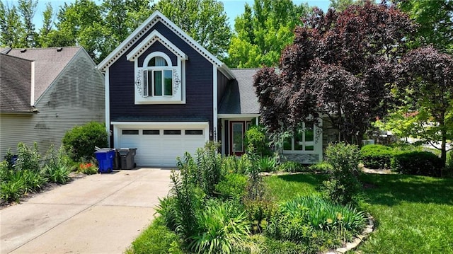 14953 W 124th Ter, Olathe, KS 66062 - view of front of house featuring concrete driveway, a garage, and a front yard