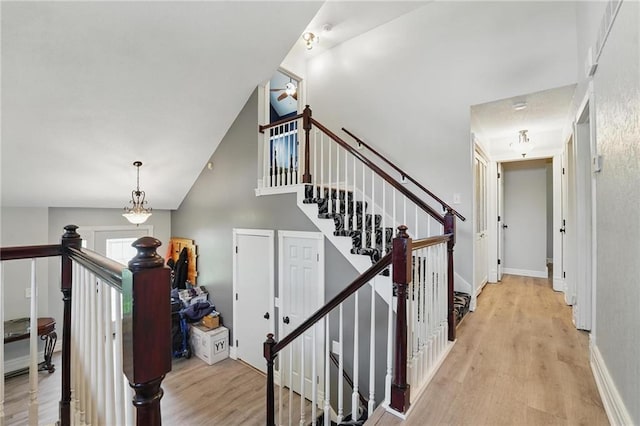 14953 W 124th Ter, Olathe, KS 66062 - stairs featuring wood finished floors and lofted ceiling