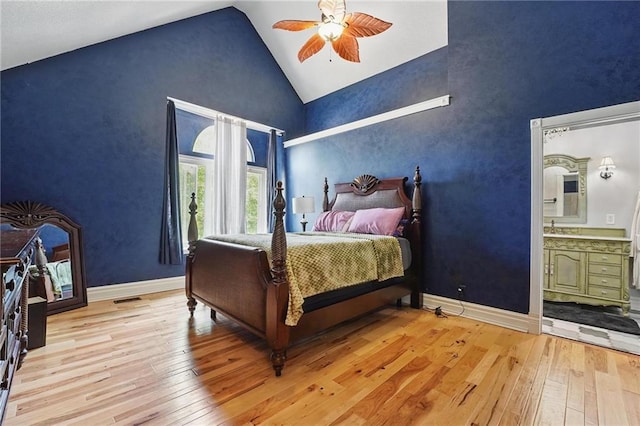 14953 W 124th Ter, Olathe, KS 66062 - bedroom featuring hardwood / wood-style floors, high vaulted ceiling, ensuite bathroom, baseboards, and ceiling fan