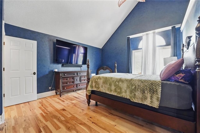 14953 W 124th Ter, Olathe, KS 66062 - bedroom featuring lofted ceiling, wood finished floors, and baseboards