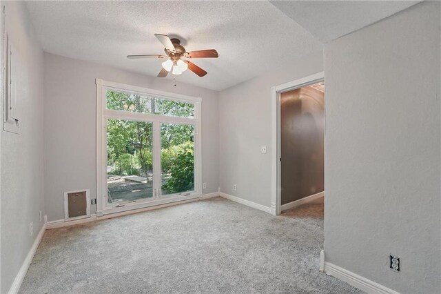 14953 W 124th Ter, Olathe, KS 66062 - unfurnished room with ceiling fan, carpet floors, a textured ceiling, and baseboards