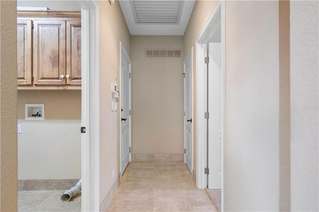 hallway with light tile patterned floors and visible vents