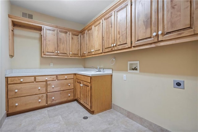 washroom with washer hookup, visible vents, cabinet space, a sink, and electric dryer hookup