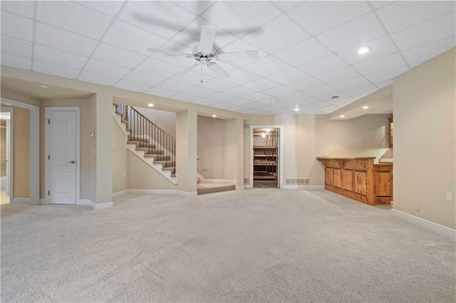 interior space with stairs, carpet flooring, visible vents, and baseboards