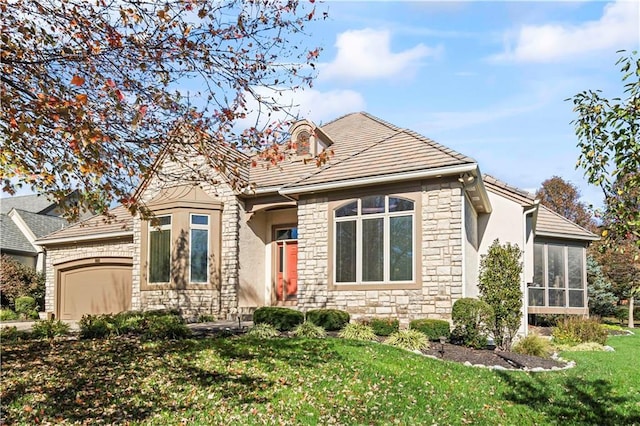 view of front of house featuring stucco siding, an attached garage, a sunroom, stone siding, and a front lawn