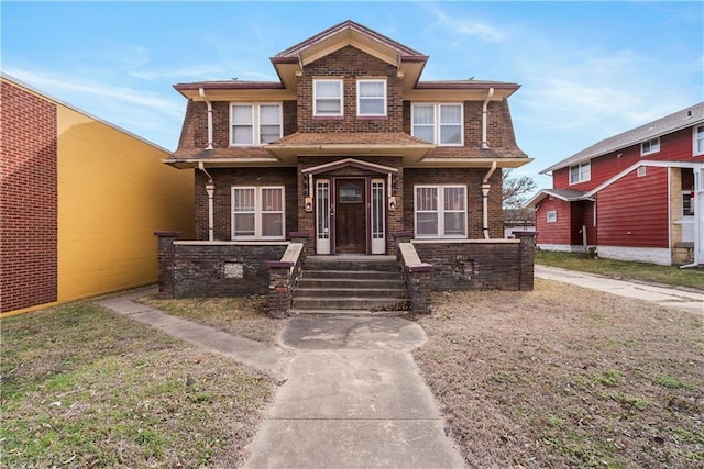 view of front of house featuring brick siding