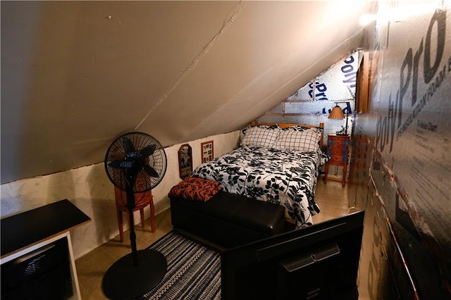 tiled bedroom featuring vaulted ceiling