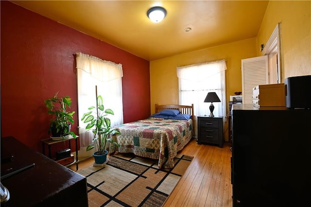 bedroom featuring light wood-style flooring