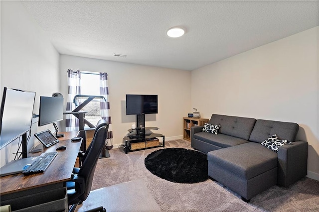 interior space featuring visible vents, a textured ceiling, and baseboards