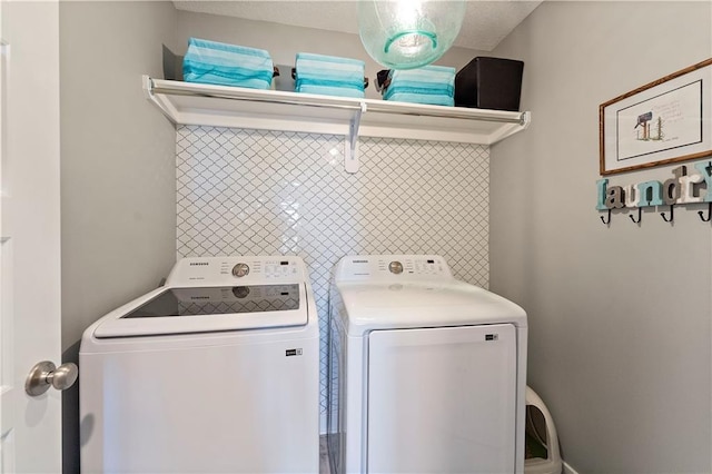 laundry area featuring laundry area and washing machine and dryer