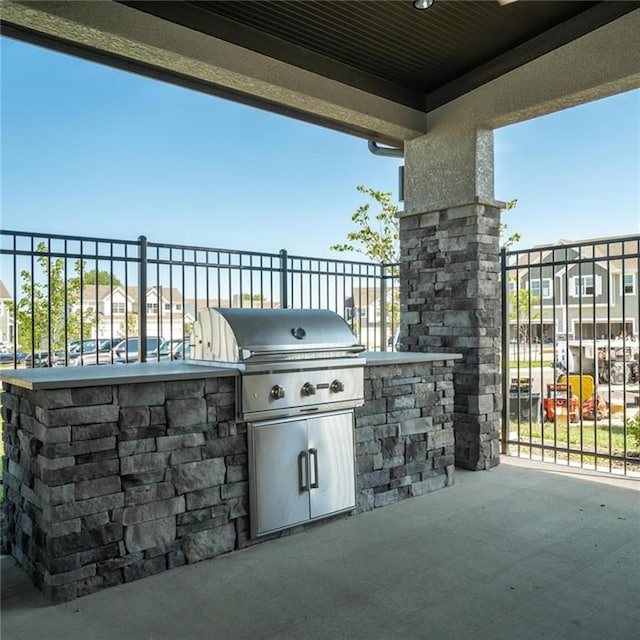 view of patio with area for grilling and an outdoor kitchen