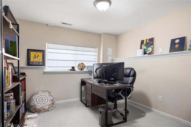 home office featuring visible vents, baseboards, and carpet