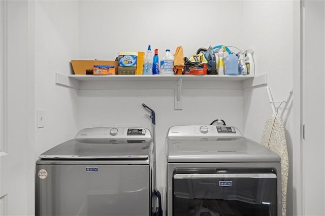 washroom with washer and clothes dryer and laundry area