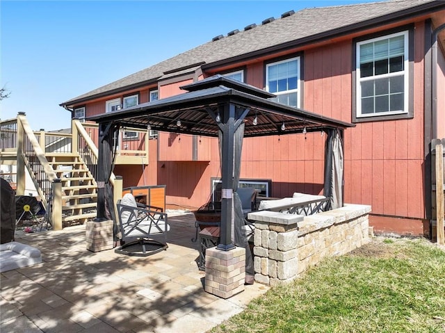 view of patio / terrace with a gazebo and stairs