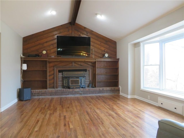 24243 Sandusky Rd, Tonganoxie, KS 66086 - unfurnished living room with wooden walls, baseboards, and wood finished floors
