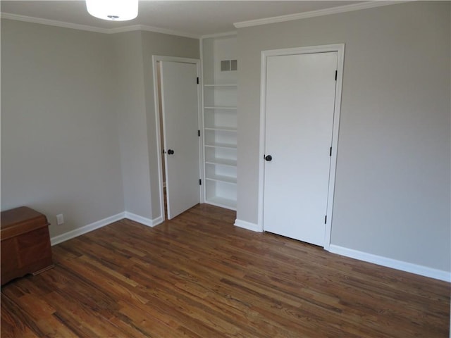 24243 Sandusky Rd, Tonganoxie, KS 66086 - unfurnished bedroom with wood finished floors, crown molding, and baseboards