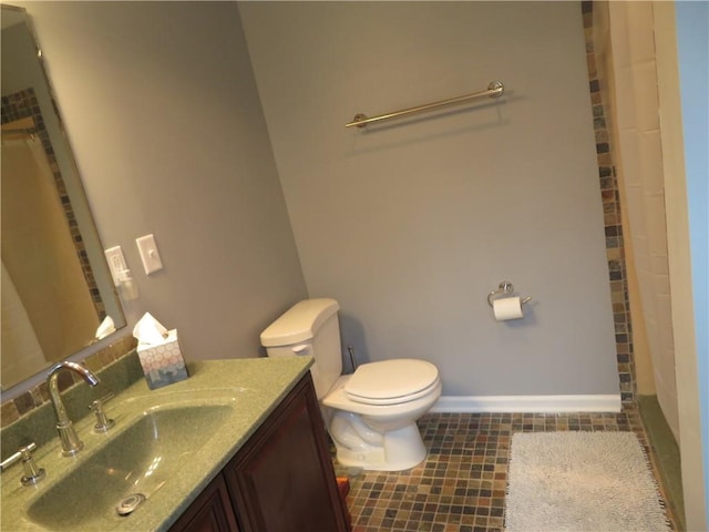 24243 Sandusky Rd, Tonganoxie, KS 66086 - bathroom with toilet, vanity, a shower with shower curtain, tile patterned flooring, and baseboards