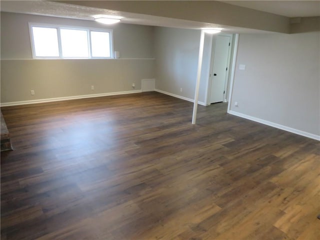 24243 Sandusky Rd, Tonganoxie, KS 66086 - basement with baseboards and dark wood-style floors
