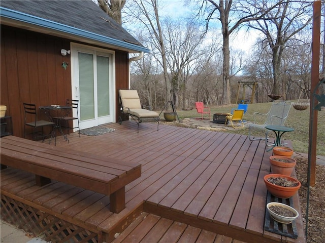 24243 Sandusky Rd, Tonganoxie, KS 66086 - wooden deck featuring a fire pit