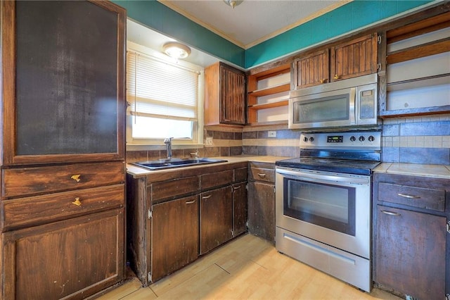 kitchen with stainless steel appliances, a sink, ornamental molding, open shelves, and tasteful backsplash