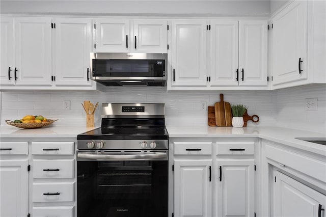 kitchen featuring appliances with stainless steel finishes and white cabinets