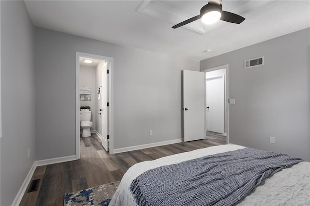 bedroom featuring wood finished floors, visible vents, and baseboards