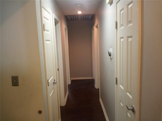 corridor featuring baseboards