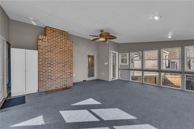 interior space with ceiling fan